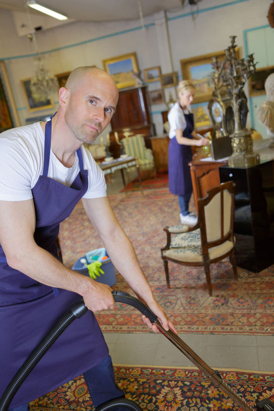 couple cleaning in stately home